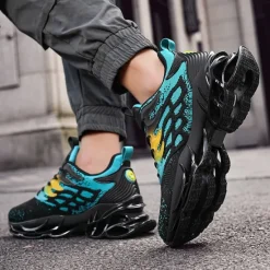 Hot OUKU Men's Blue Athletic Sneakers with Unique Hollow Sole Design, Breathable Knit Upper, and Flame Detail – Lightweight Running Shoes with Orange Accents